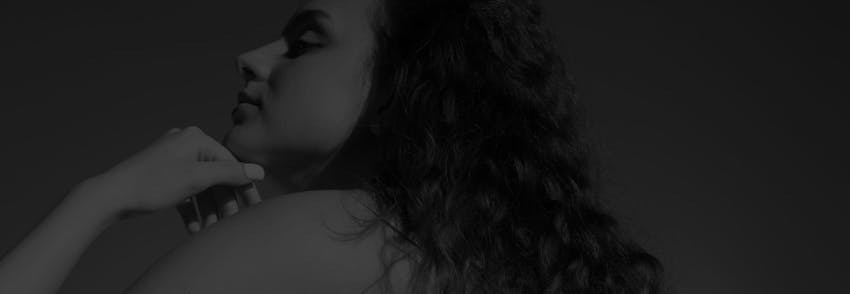 woman touching her chin