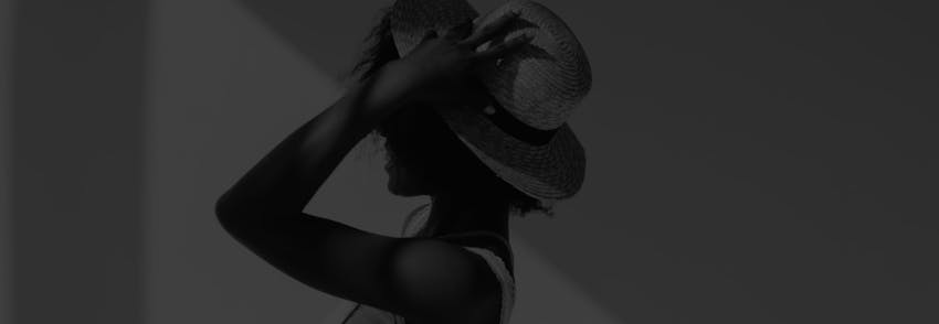 woman touching her hat