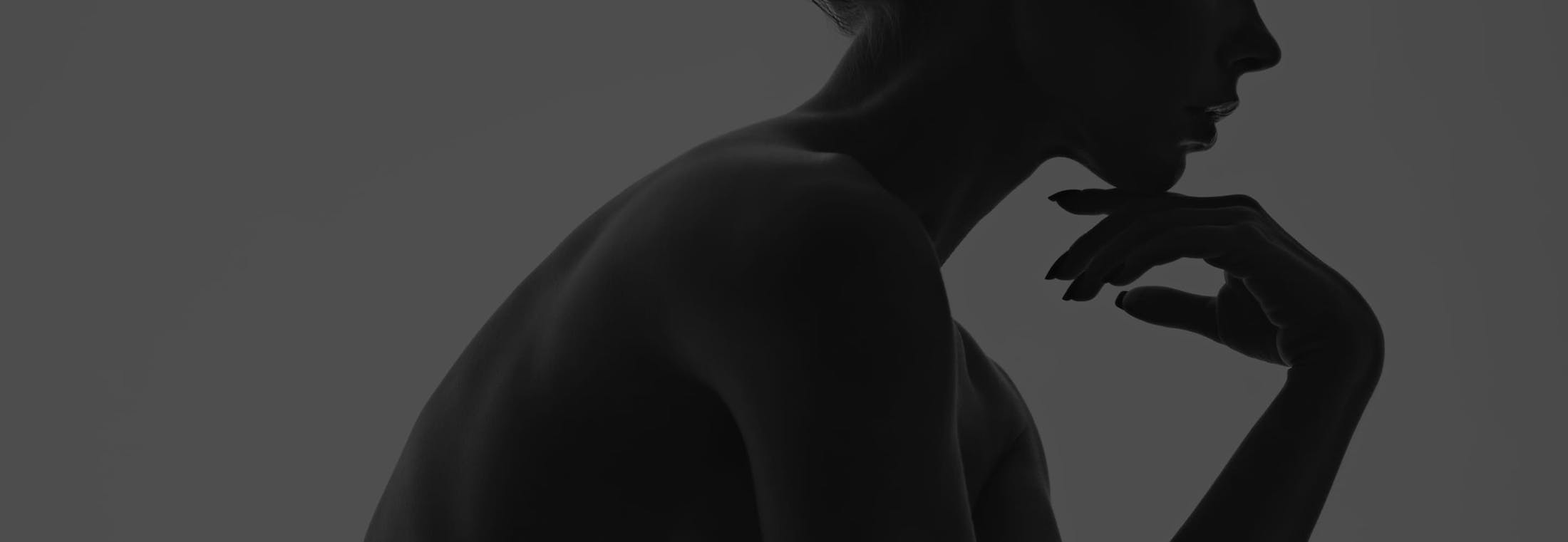 woman touching her chin