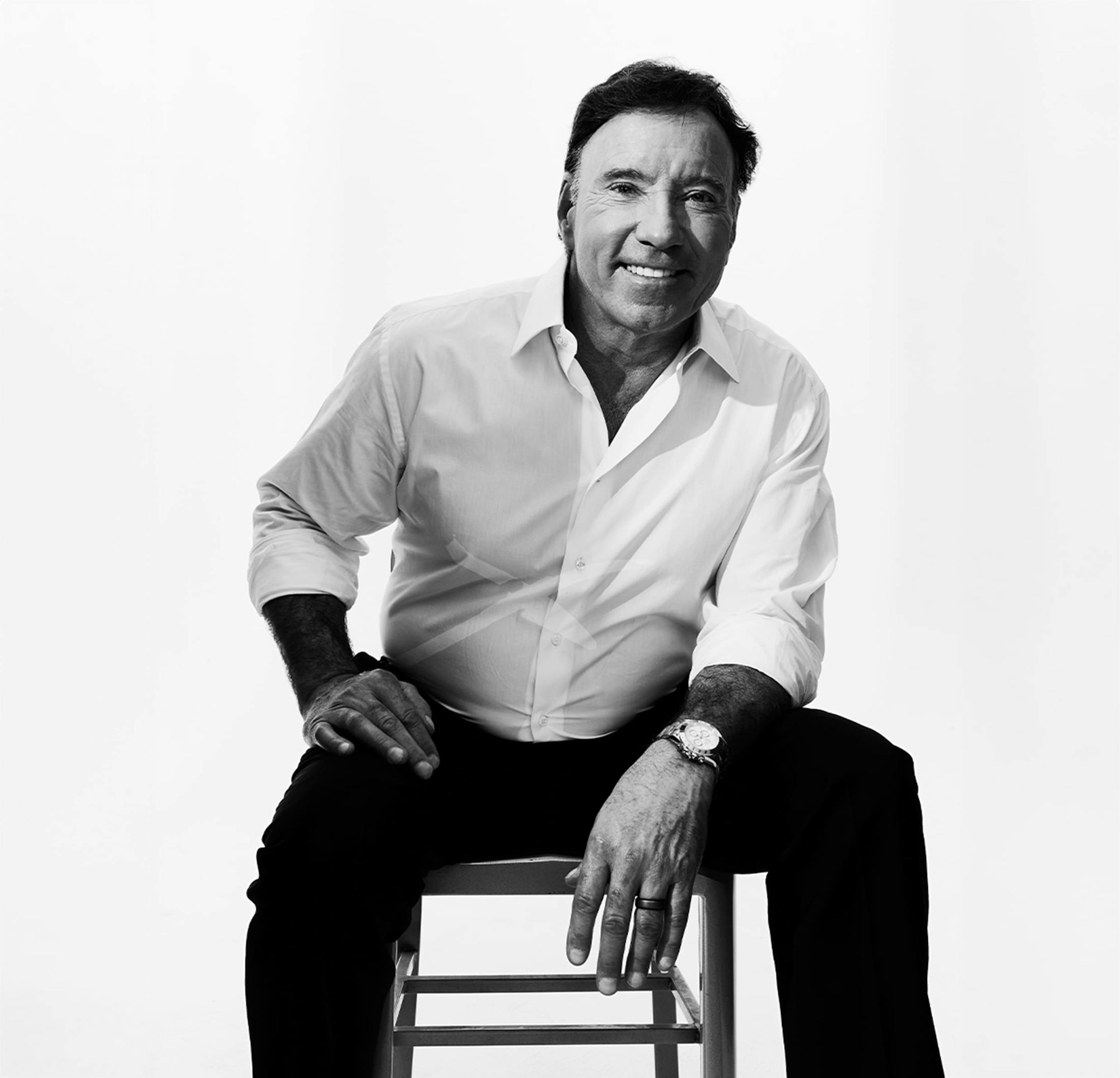 Dr. Fisher sitting on a chair