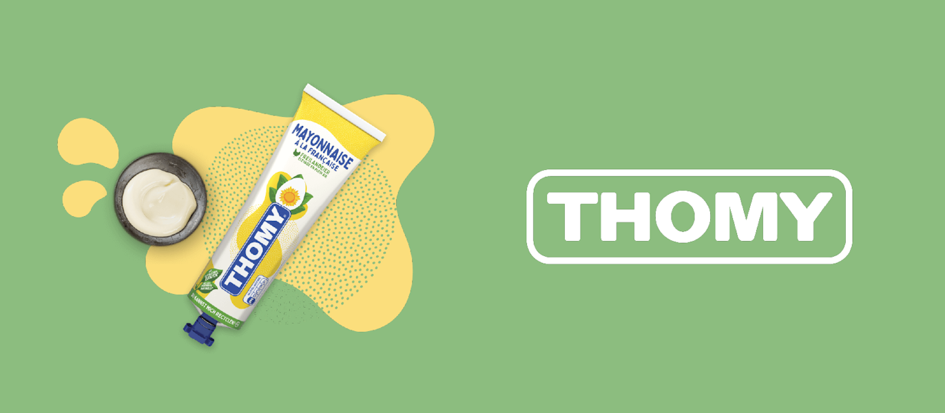 A tube of Thomy mayonnaise with an open cap and mayonnaise dollop is shown on a green background next to the Thomy logo.
