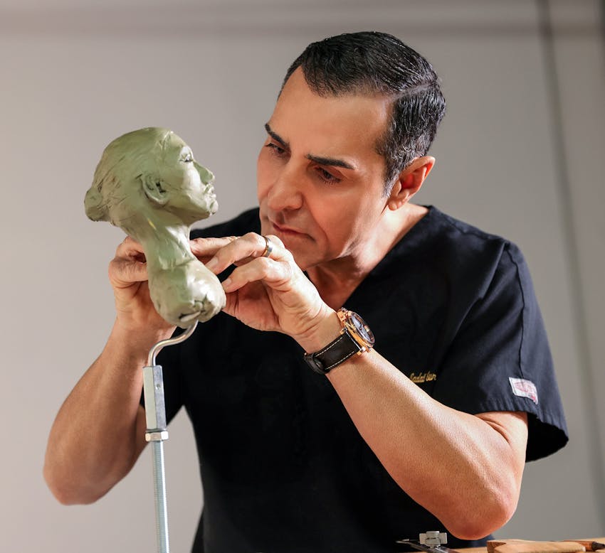 Dr. Kevin Sadati sculpting a female face
