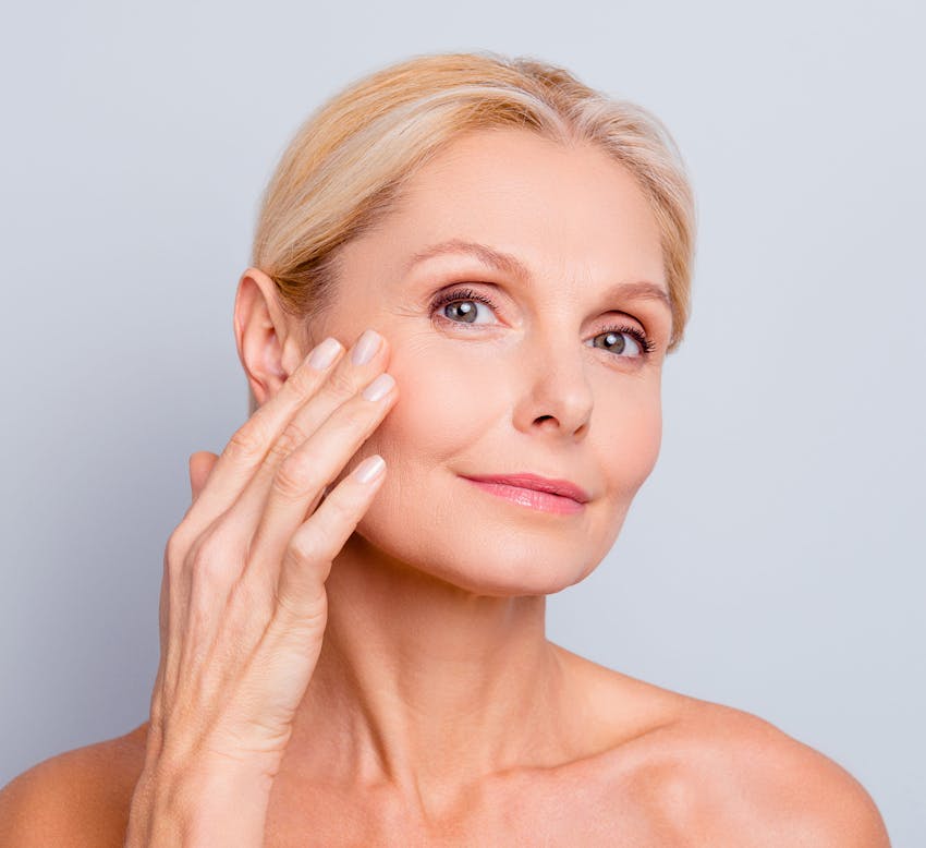 Woman with her hand on her face