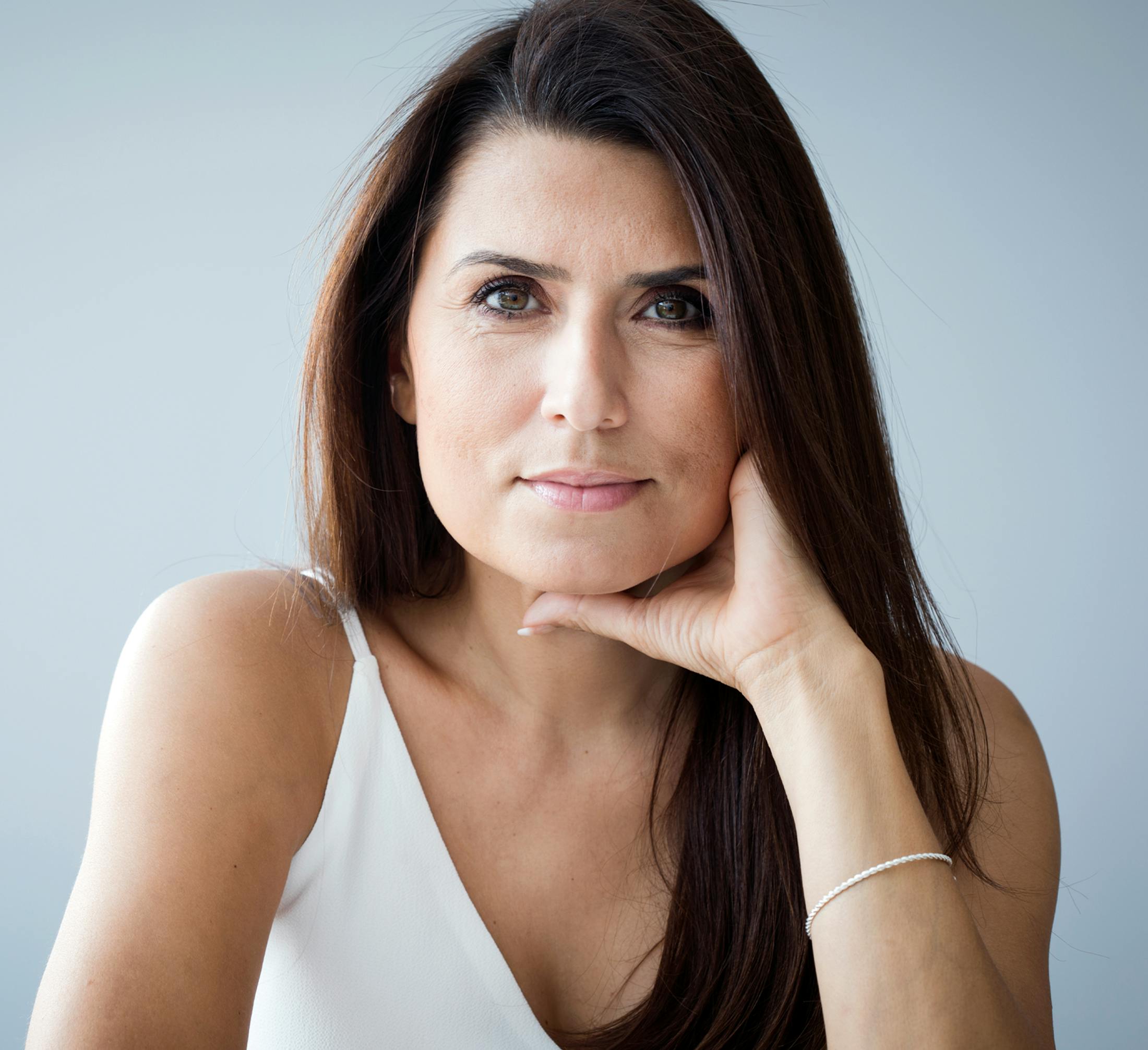 woman in her 40s with long dark hair