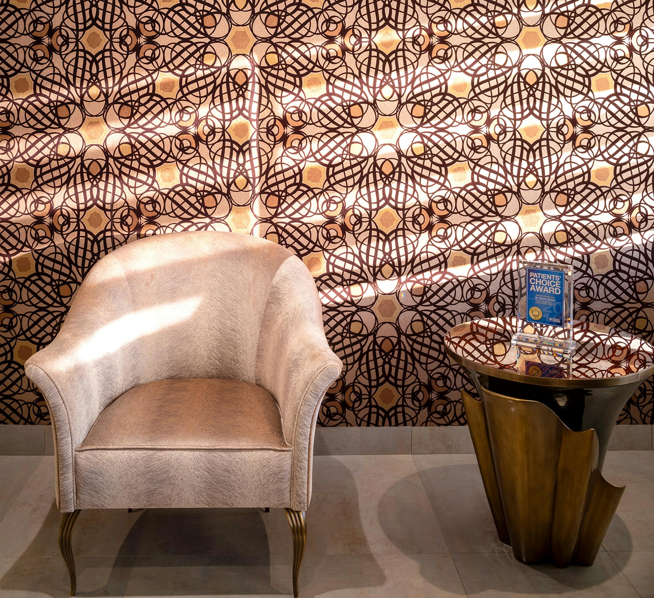 patterned office wall with chair and side table