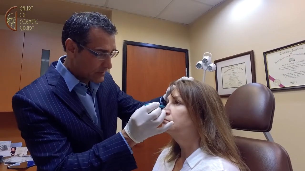 Dr. Sadati marking patients nose in non-surgical nose job consultation