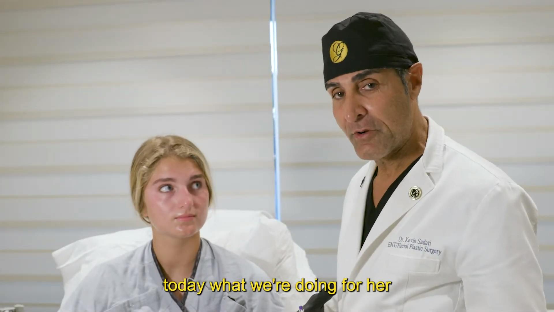 Dr. Sadati explaining procedure to teen about to undergo a septorhinoplasty