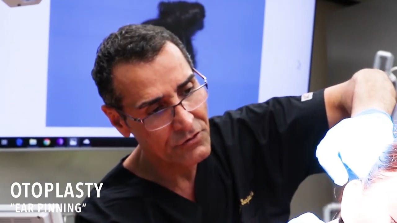 Dr. Sadati doing an otoplasty on a patient