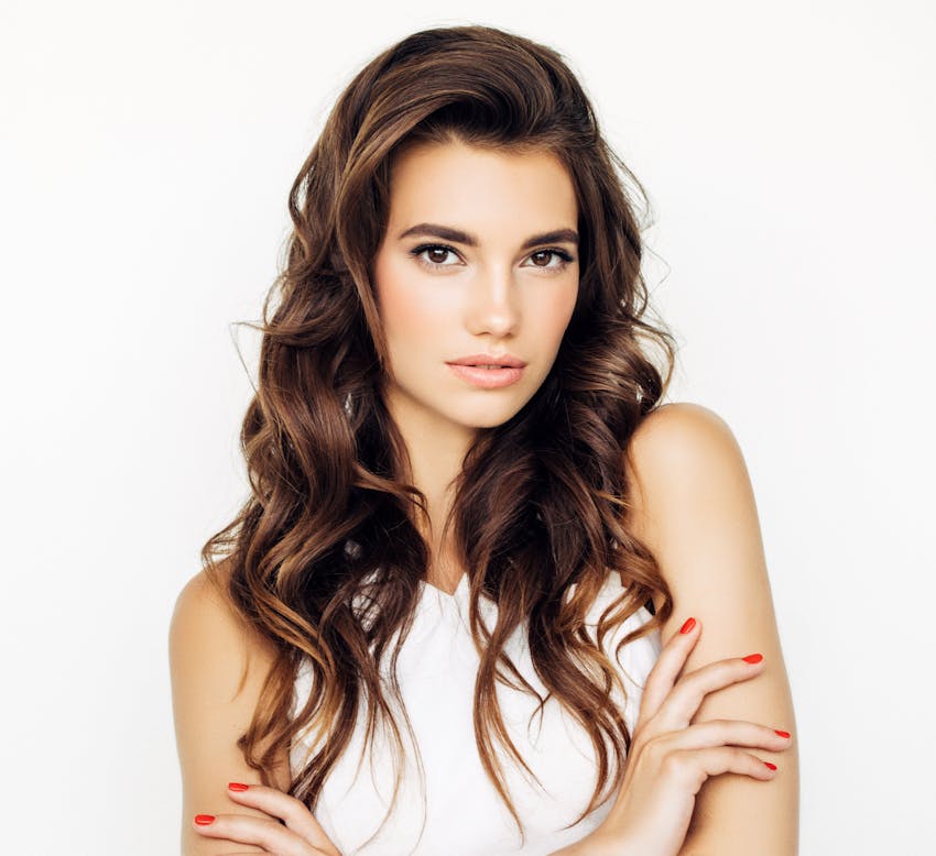 woman with curly auburn hair