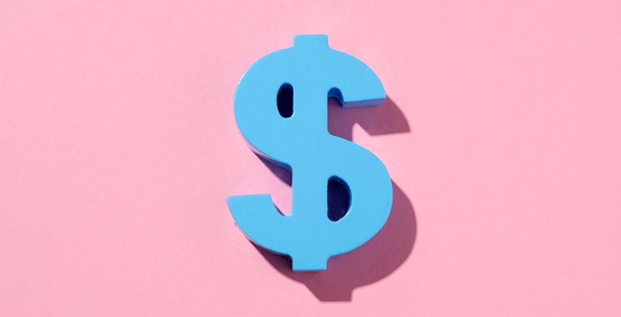 An image of a blue dollar sign on a pink background.