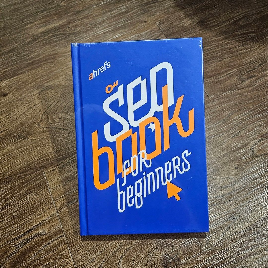 [Screenshot description: Cover of the Ahrefs SEO Book for Beginners showing the hardcover design]