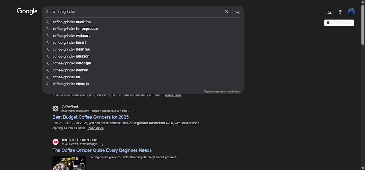 [Screenshot: Google search bar showing autocomplete suggestions for &ldquo;coffee grinder&rdquo; &mdash; displaying suggestions like &ldquo;coffee grinder manual,&rdquo; &ldquo;coffee grinder electric,&rdquo; &ldquo;coffee grinder burr vs blade&rdquo;]