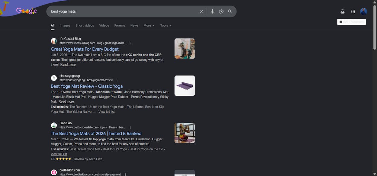 [Description of the screenshot to use: SERP for &ldquo;best yoga mats&rdquo; showing a list of comparison-style blog posts at the top, with a sidebar showing a competing product page that has many more backlinks but doesn&rsquo;t appear in the top 10]