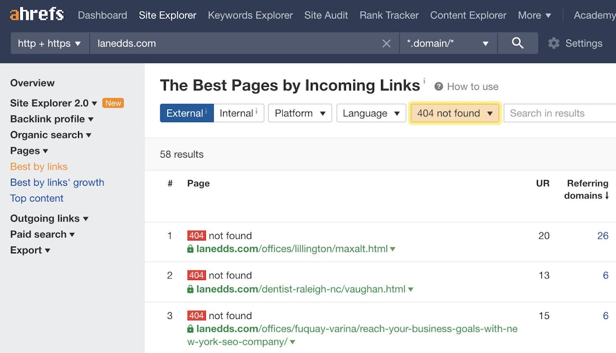 Ahrefs Site Explorer Best by links report with 404 status filter applied, showing dead URLs ranked by referring domains