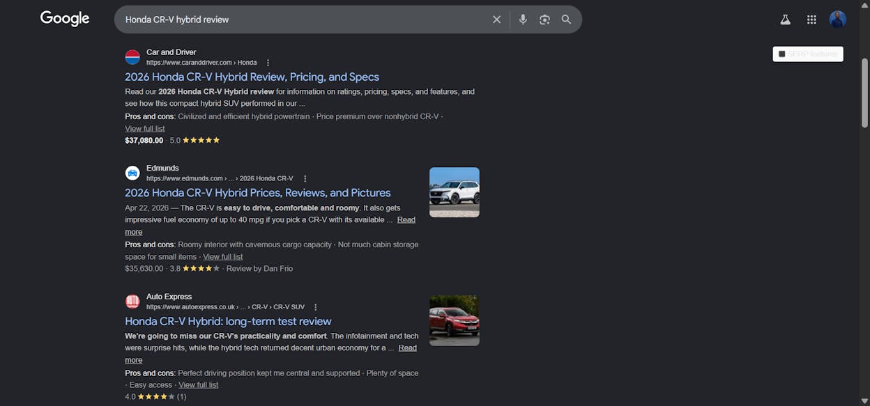 [Screenshot of a Google SERP for a car model query showing the YouTube video carousel above the text results]