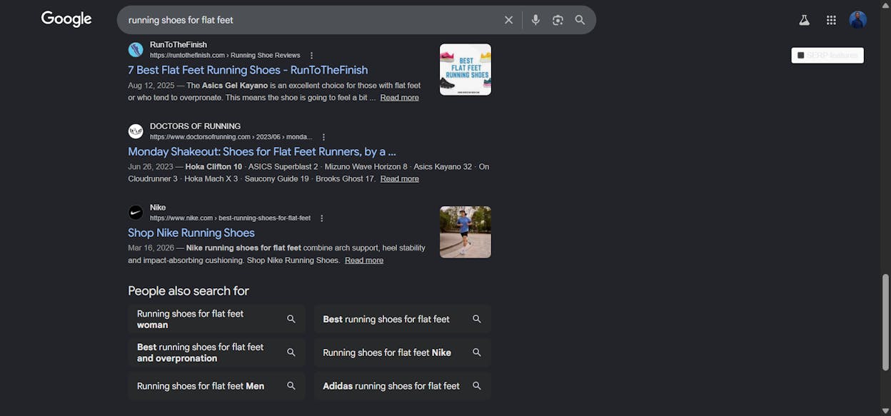 Google "Related searches" panel at the bottom of the SERP for "running shoes for flat feet" showing related queries