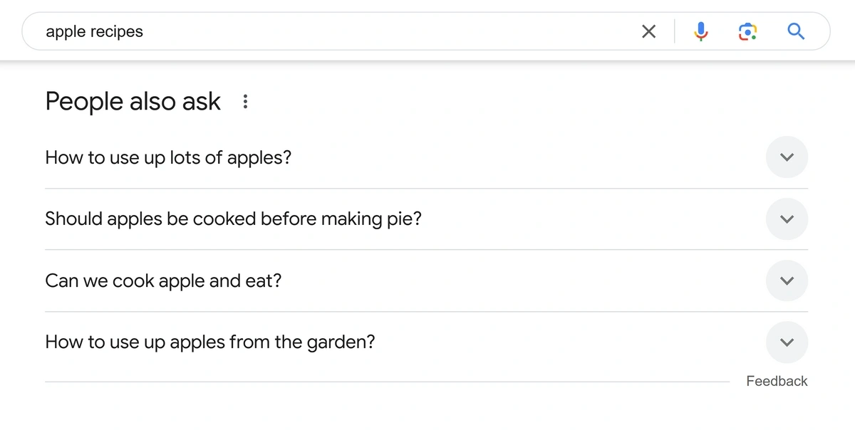 Google SERP showing a PAA box with four expandable questions, with one question expanded to show the answer text and source link