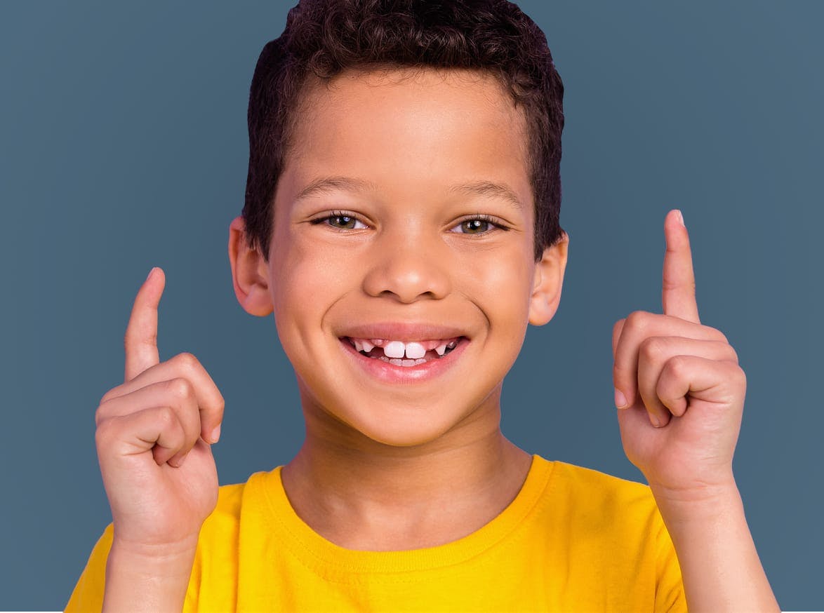 little boy pointing up