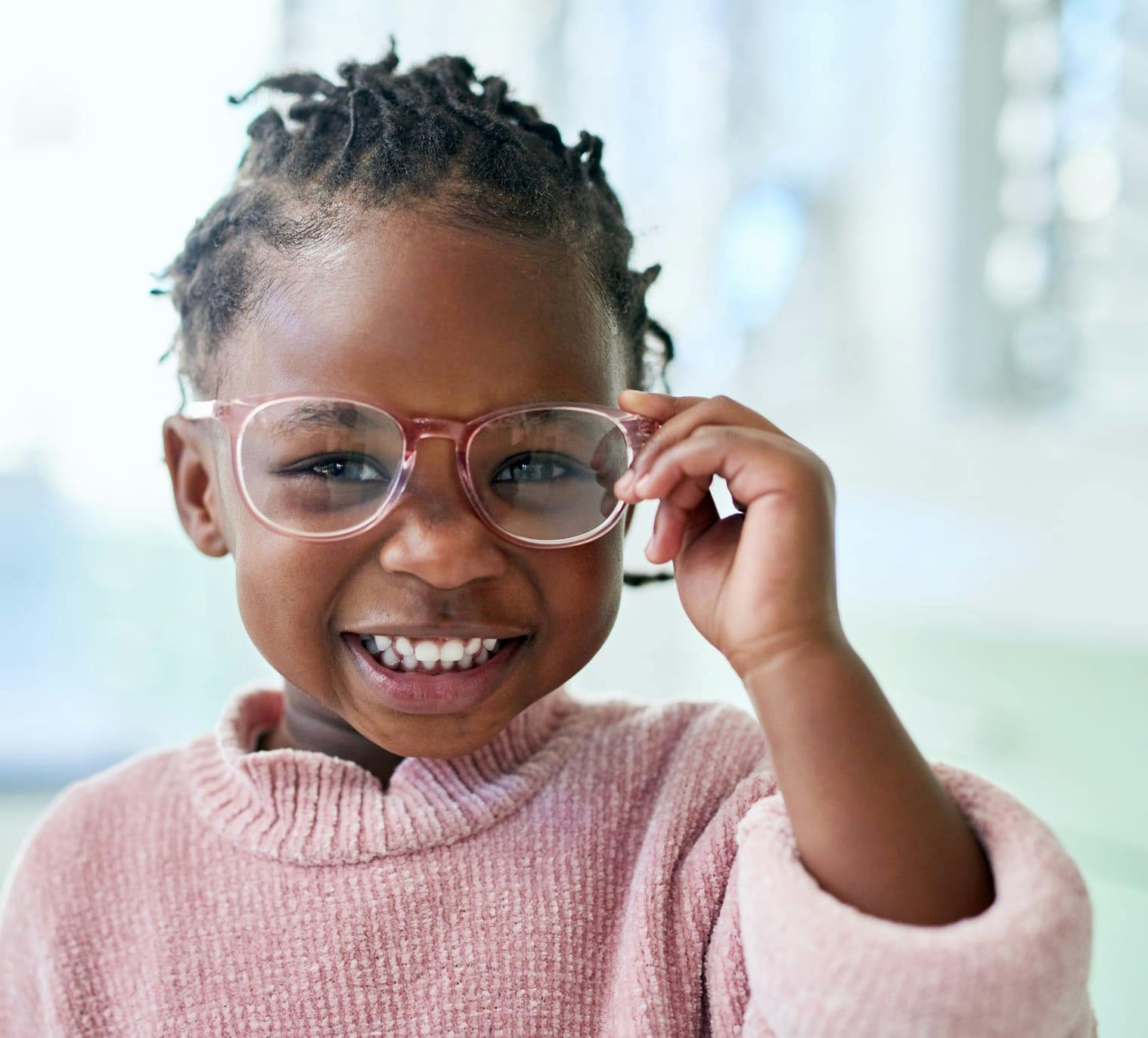 Girl smiling with glasses on