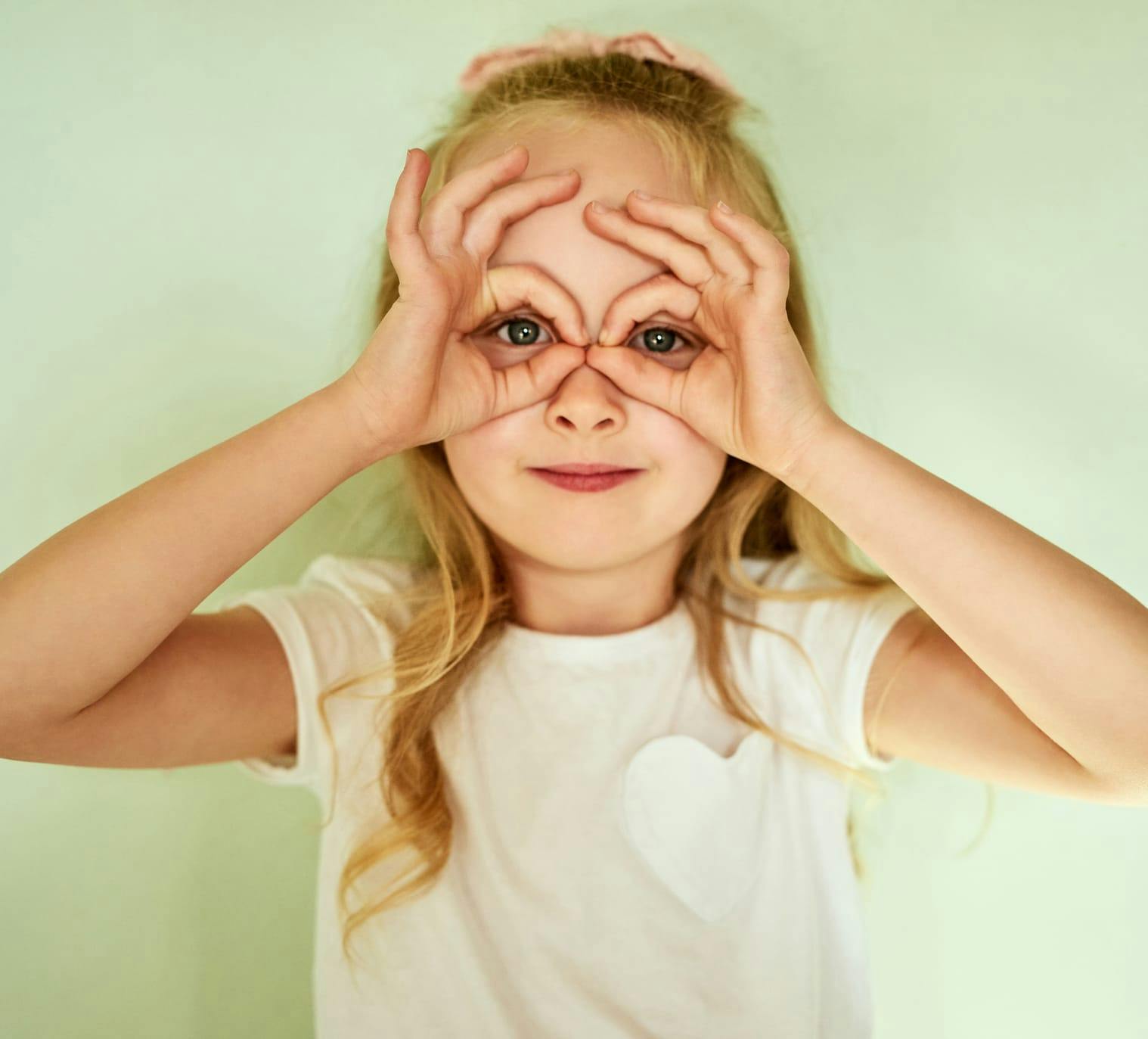 Girl making glasses with her hands