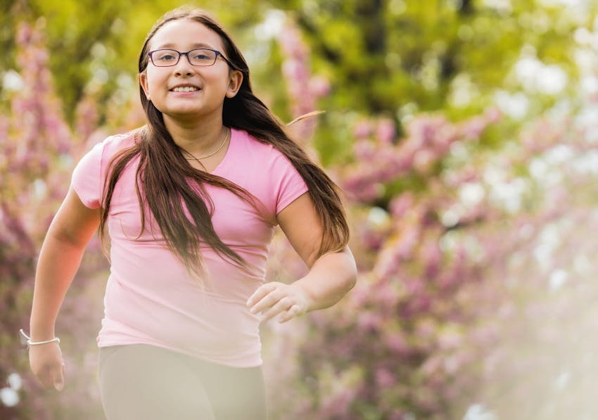 Girl running while wearing glasses