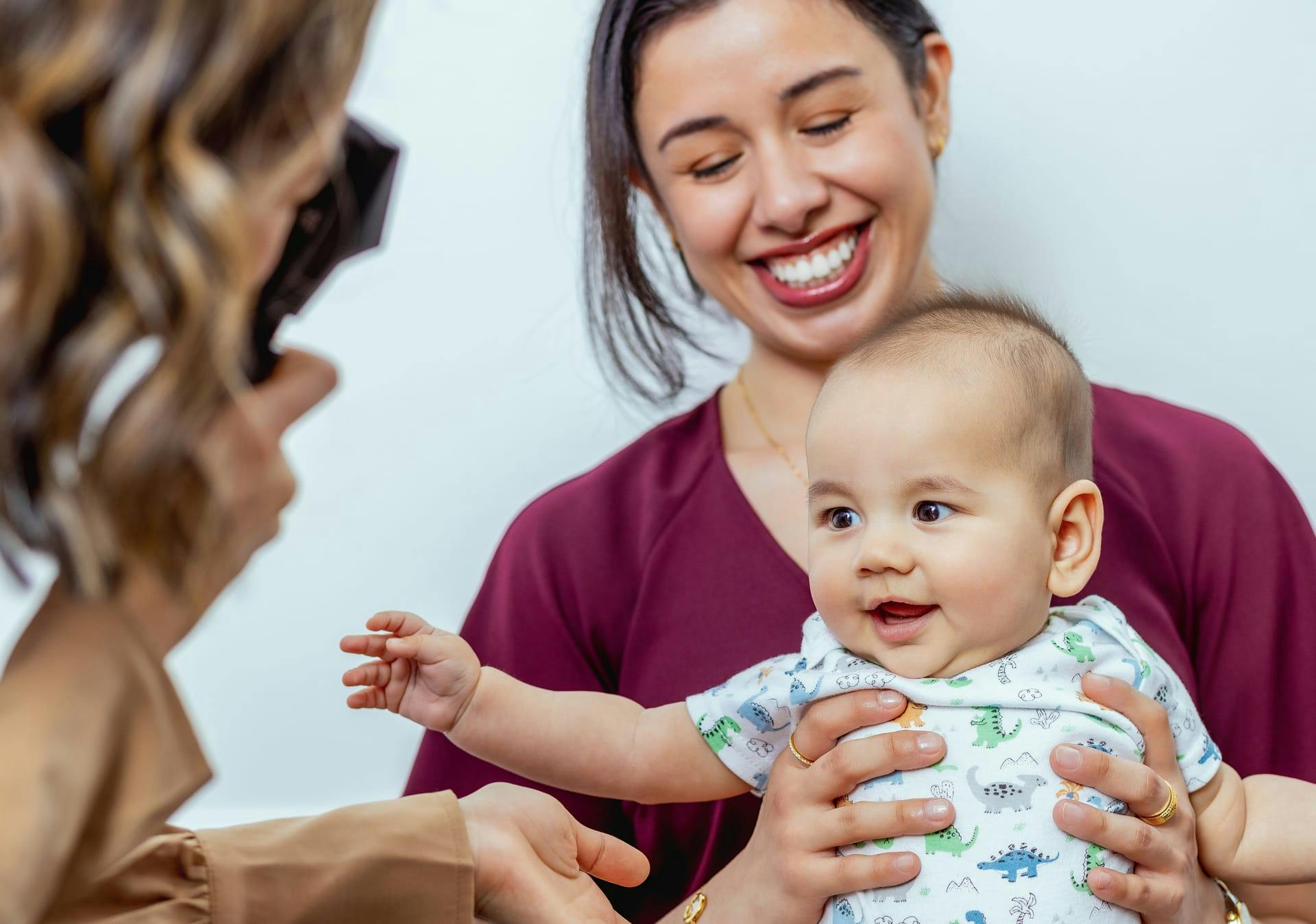 Woman and her baby smiling