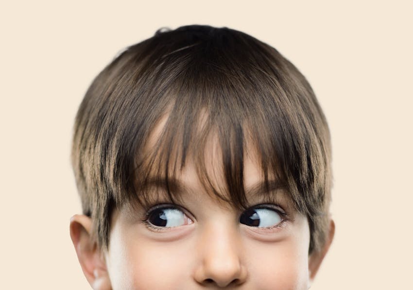 young kid looking to the side