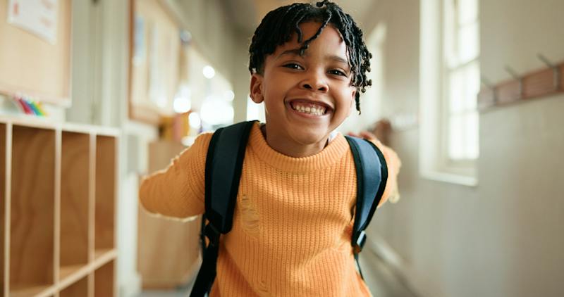 Kid wearing a backpack