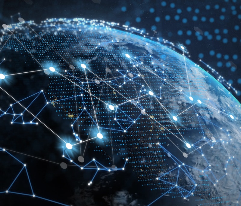 Digital network connections overlaying Earth viewed from space, symbolizing global connectivity and data exchange.