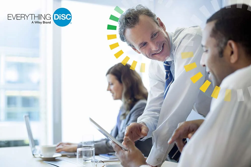 A professional mentoring moment, with DiSC personality graphics identifying different working styles.