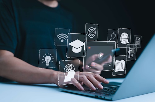 Person using a laptop with floating digital icons representing online learning and innovation.