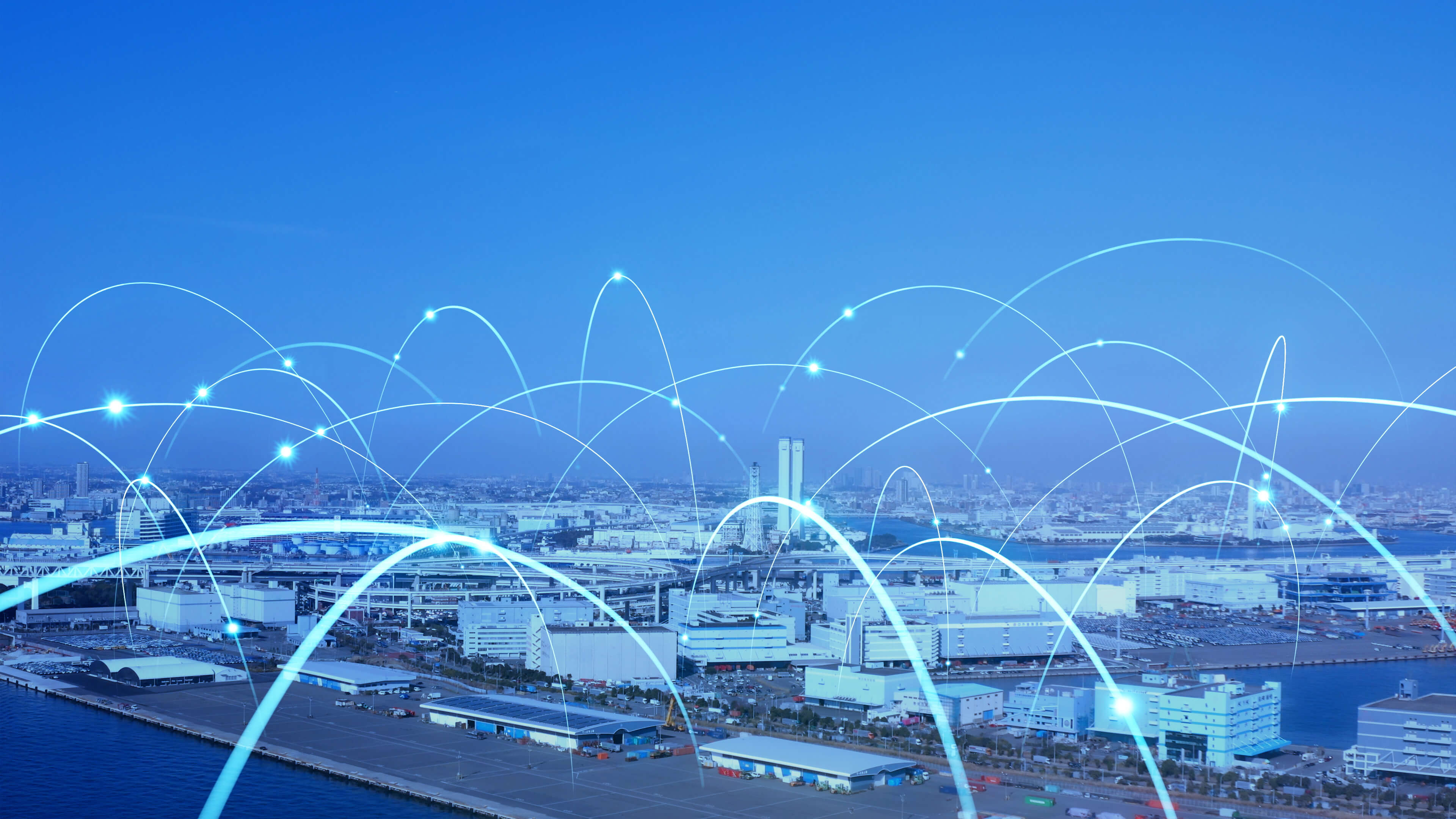 Smart city skyline with glowing network lines representing digital connectivity.