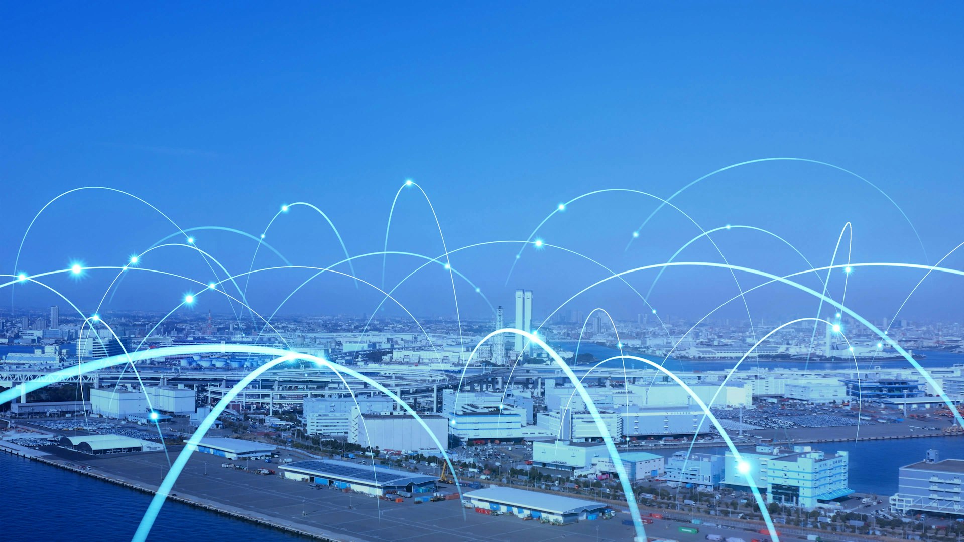 Smart city skyline with glowing network lines representing digital connectivity.