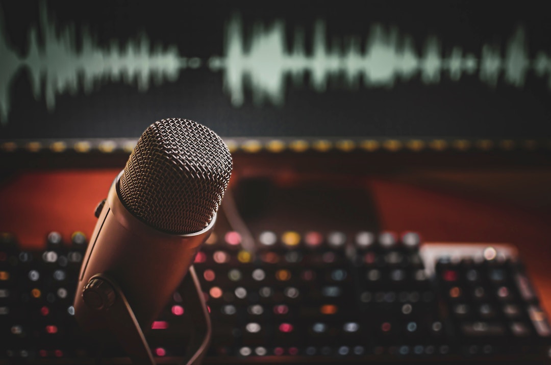 Home studio: microphone and wave form on screen fpr podcasts