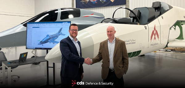 Ryan Griffin shaking hands with Mark Williams in front of Aeralis aircraft