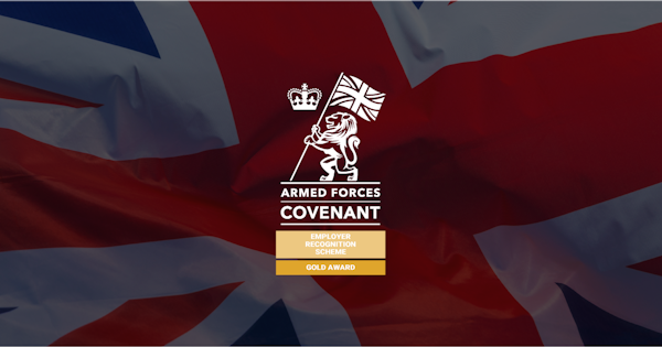 gold armed forces covenant logo on top of british flag