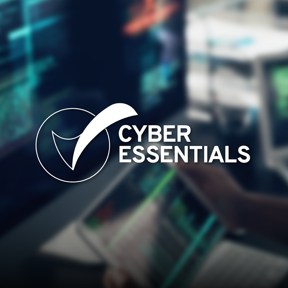blurred background of data on a tablet, cyber essentials logo in white