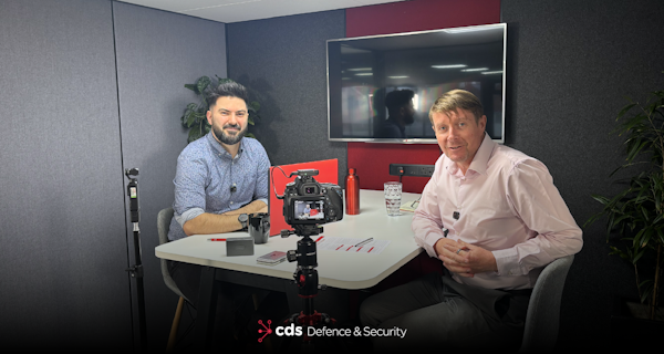 Karl Rees and Martin Nash smiling to camera on set of Episode 8 of the Briefing Room Podcast around Insider Threat