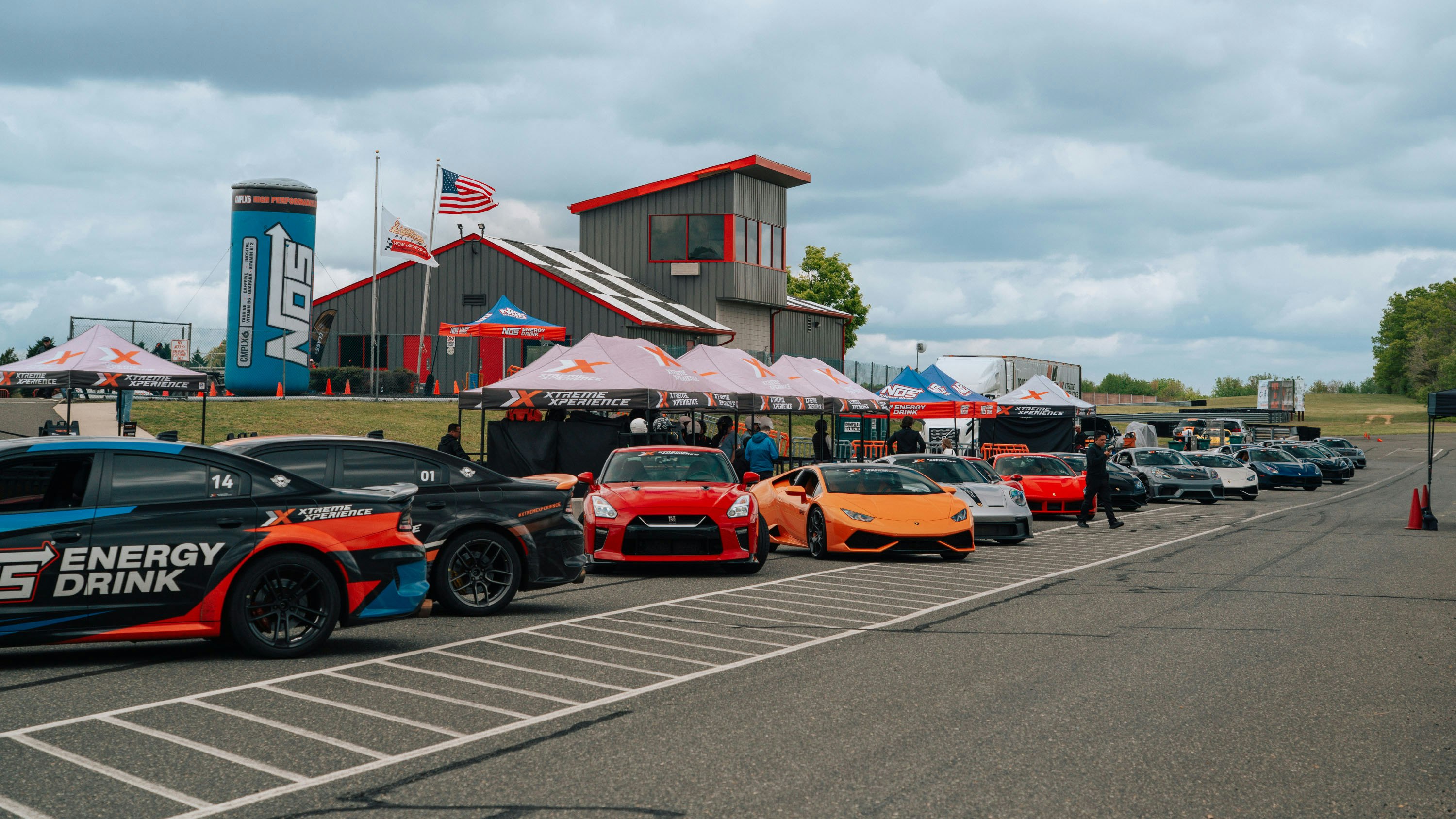 Pit Lane at New Jersey Motorsports Park Xtreme Xperience fleet parked in pit lane before supercar driving experiences at New Jersey Motorsports Park