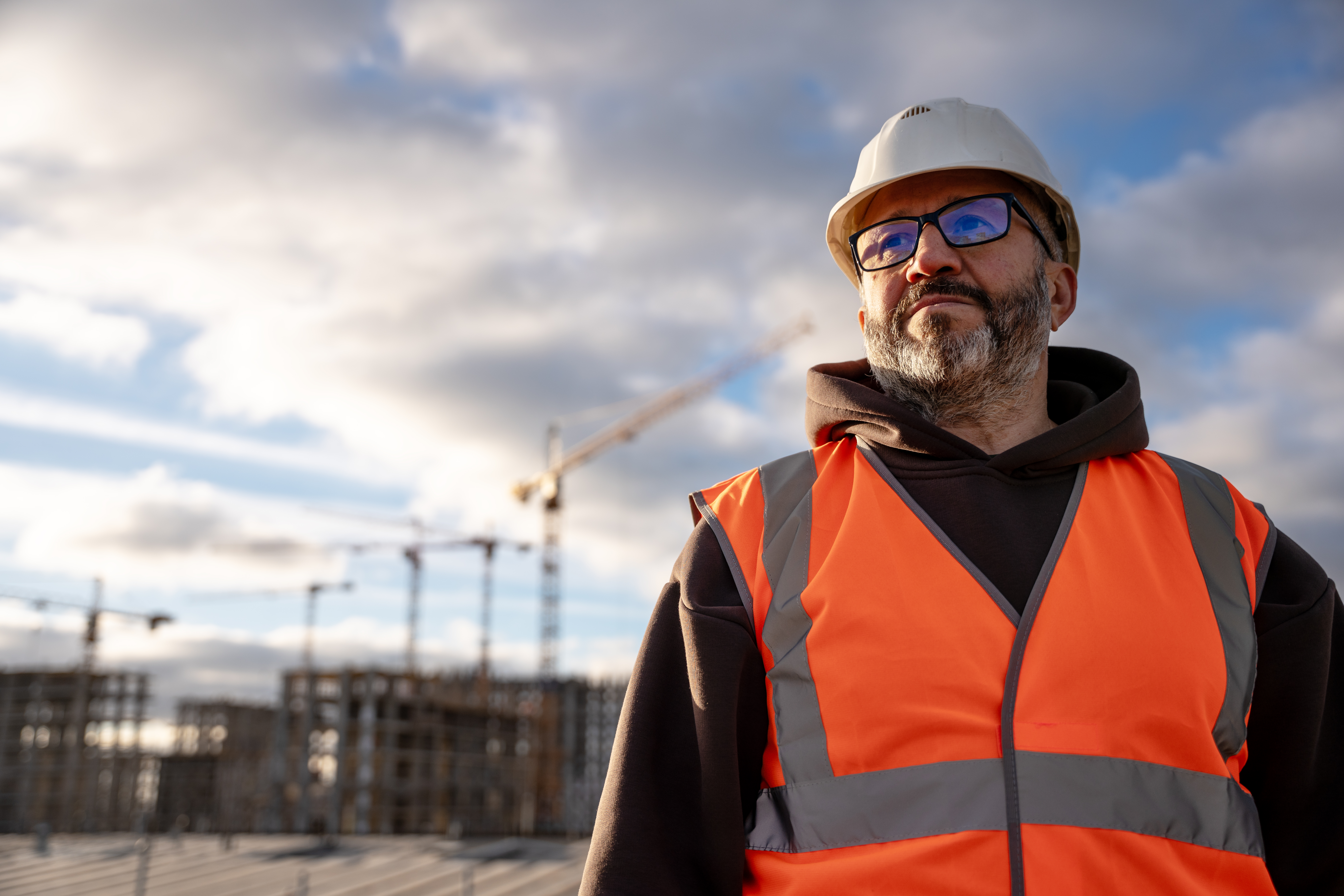 Man overlooking construction site