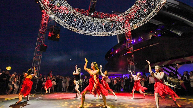 Aboriginal and Torres Strait Islander dancers perform a Welcome to Country ceremony on centre stage.