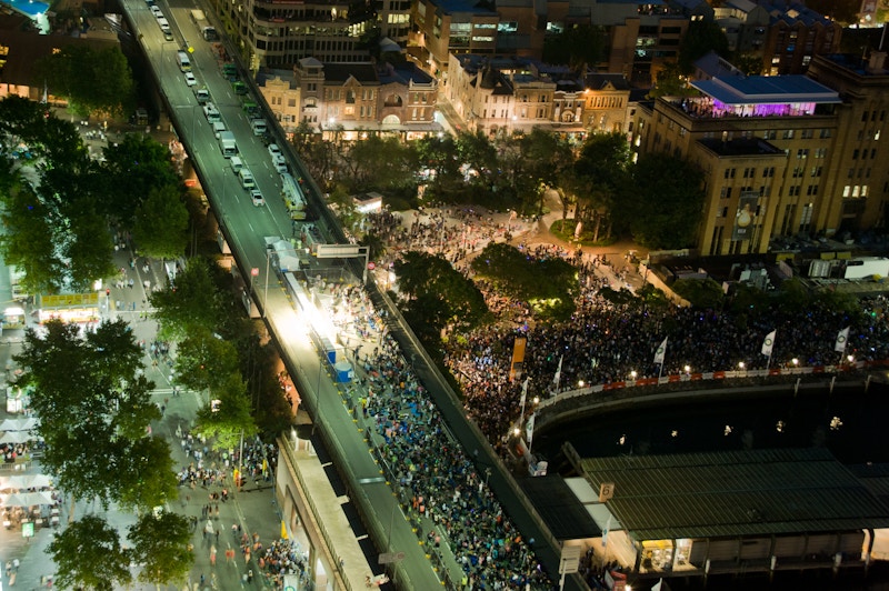Aerial view of New Year’s Eve spectators on the closed Cahill Expressway and spectators packed into the Circular Quay foreshore.
