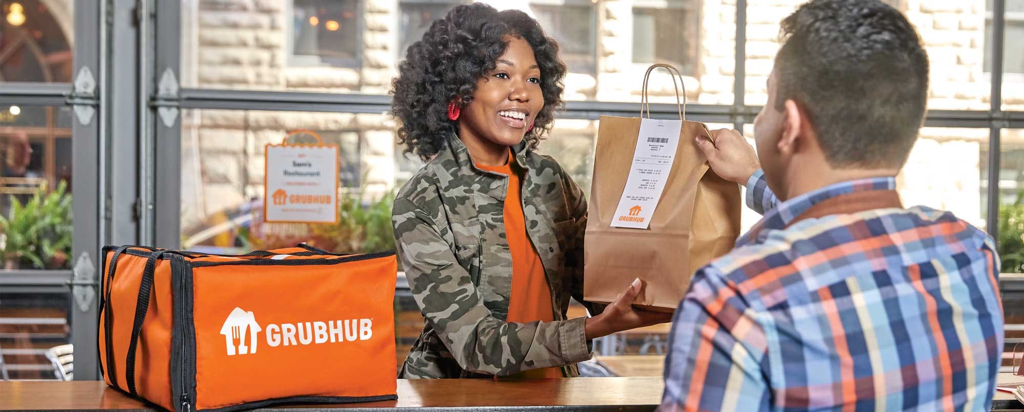 Grubhub-Woman-Receiving-Bag-Restaurant