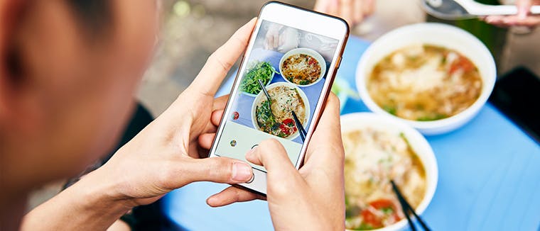 Restaurant client taking food photo, Deliverect