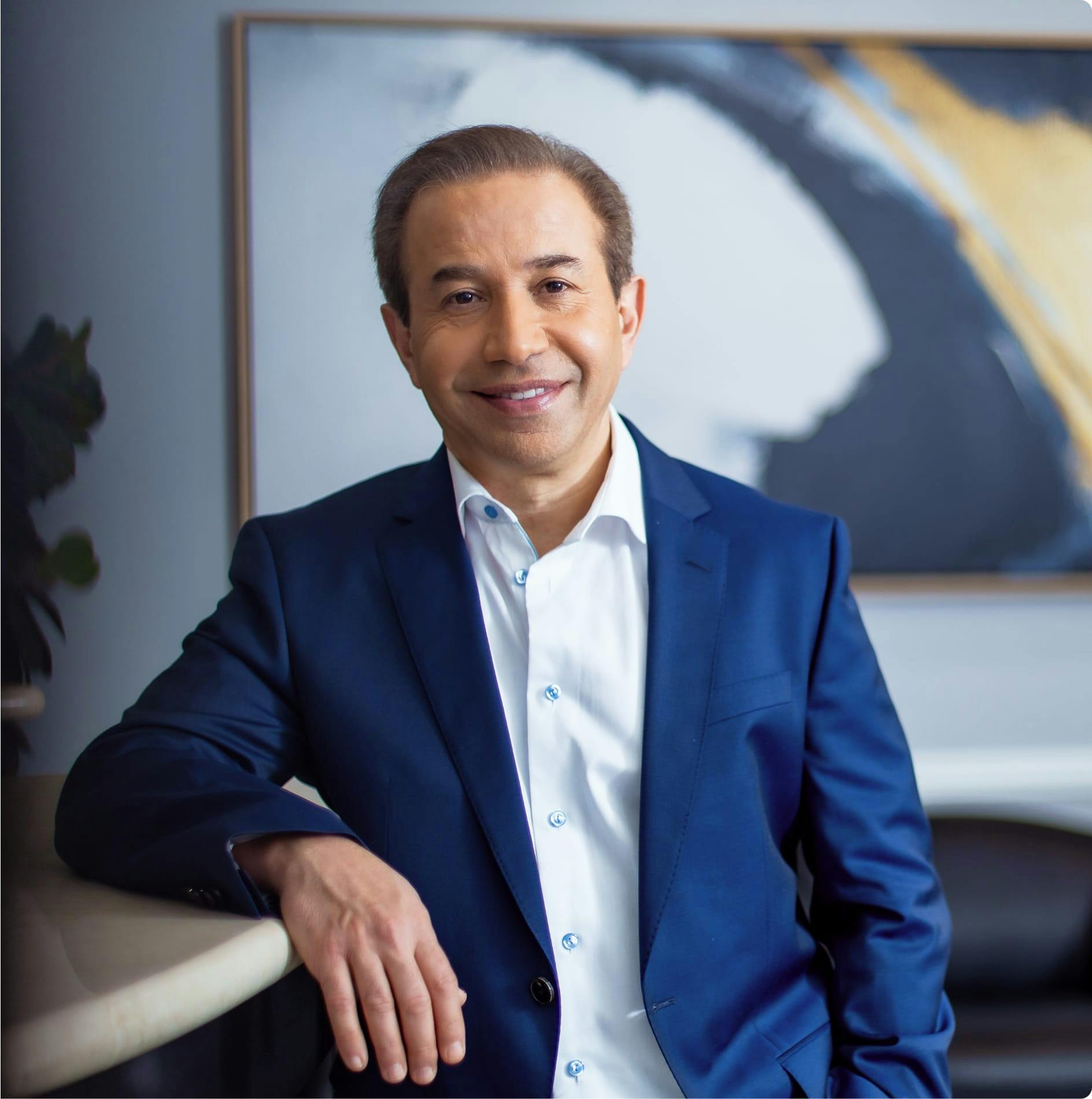 Dr. Bolourian in a suit at the front desk