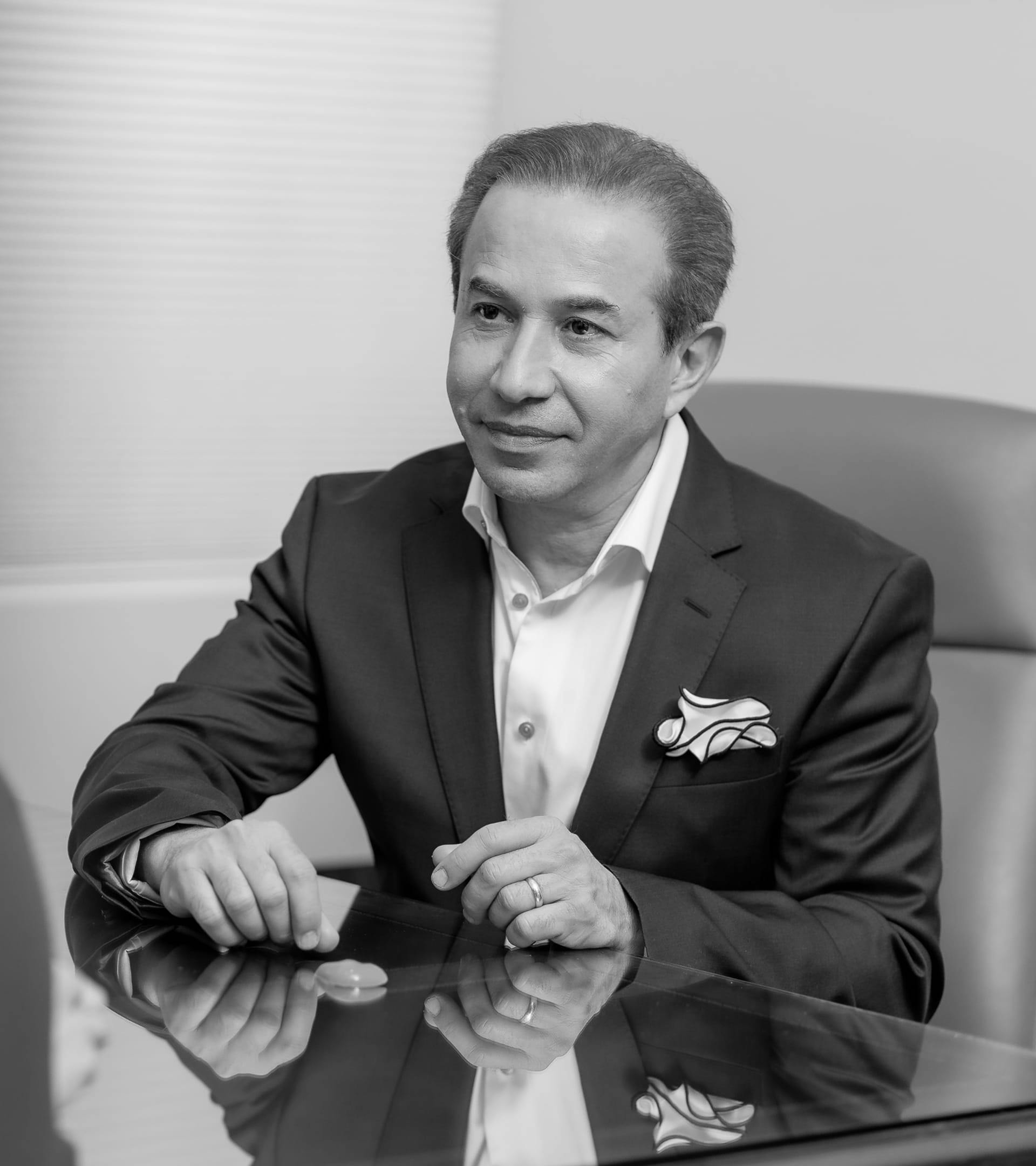 Dr. Bolourian in a suit, black and white image