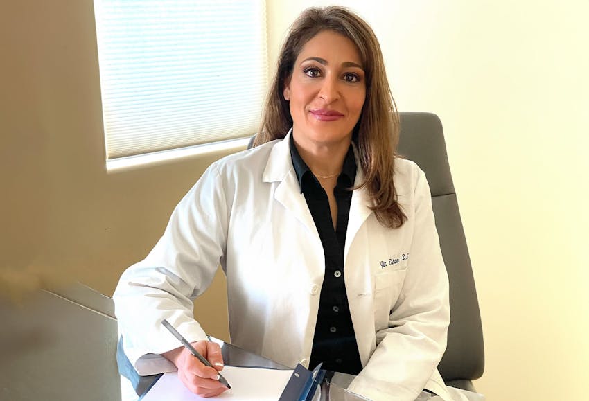 Female doctor with pen in her hand