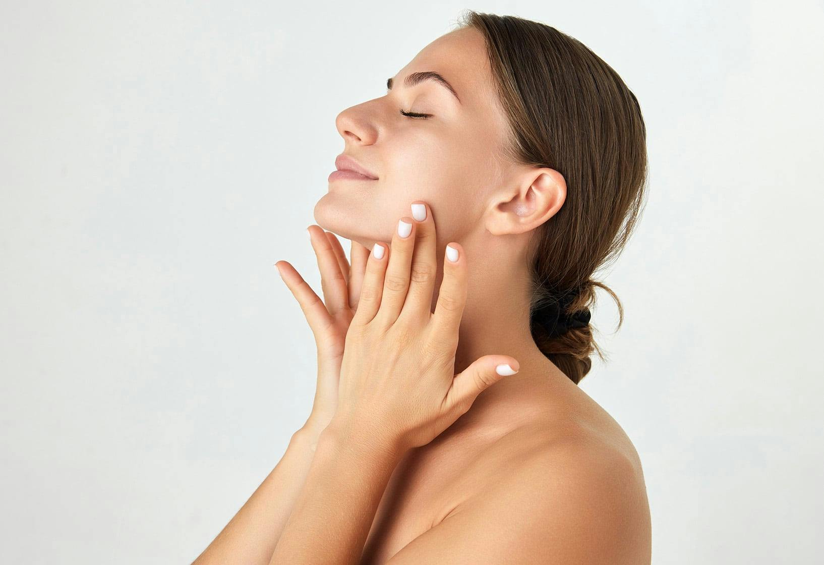 Woman touching her neck