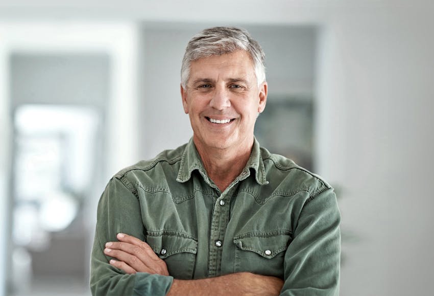 Older man with arms crossed