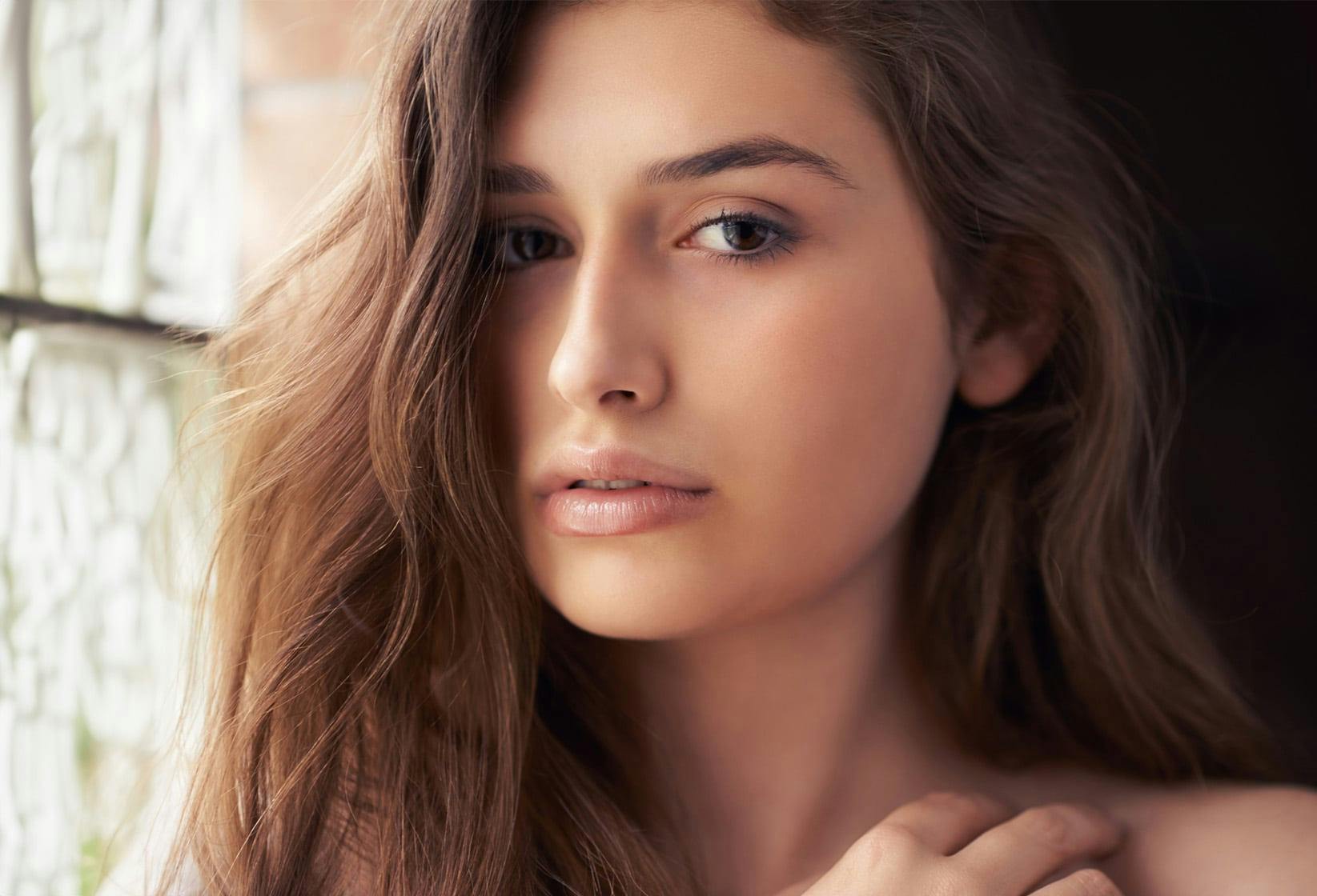 brunette woman looking at camera
